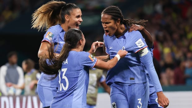 France’s Wendie Renard, right, celebrates with teammates.